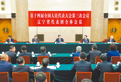 中共中央政治局常委、大陸國務院副總理丁薛祥5日來到他所在的遼寧代表團,同代表們一起審議政府工作報告。(新華社) image
