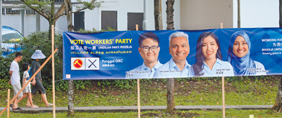 新加坡國會選舉2日進入投票前一天的冷靜日,所有的競選活動均終止。圖為最大反對黨工人黨的宣傳海報,掛在街頭靜靜向民眾拉票。(鄭任南攝) image