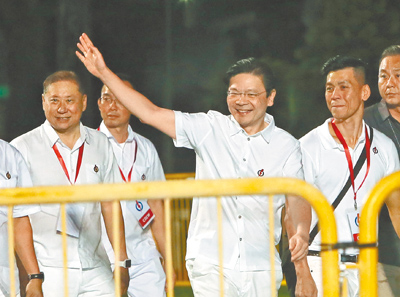 新加坡總理黃循財率領人民行動黨,繳出亮眼成績單。(鄭任南攝) image