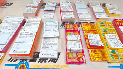 刑事局南部打擊犯罪中心查獲詐騙集團要被害人向幣商買虛擬貨幣,幣商竟與彩券行合謀,把收到的現金當成批購刮刮樂本錢,還賣給其他民眾,警方查扣1批面額總價值138萬元的台彩刮刮樂。(讀者提供/洪靖宜高雄傳真) image