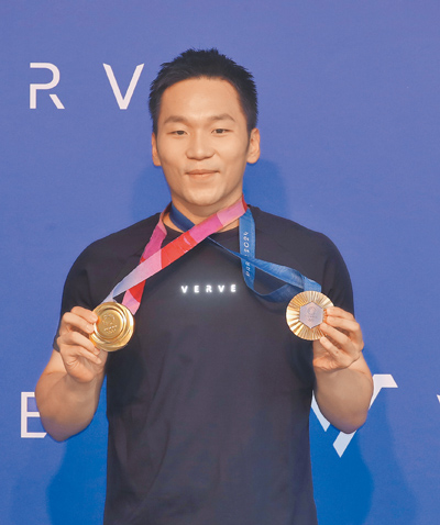 奧運羽球男雙金牌選手李洋可望出任首位運動部長。(本報資料照片) image
